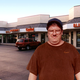 Schaumberg resident Allen Koechley stands in the parking lot of one of the suburb's 4,894 strip malls.